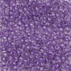 TOHO-perler runde 11/0 – lyselilla, 935 Purple lined crystal